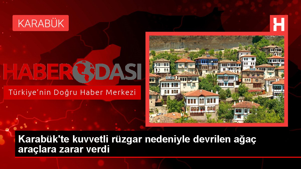 Karabükte kuvvetli rüzgar nedeniyle devrilen ağaç araçlara zarar verdi